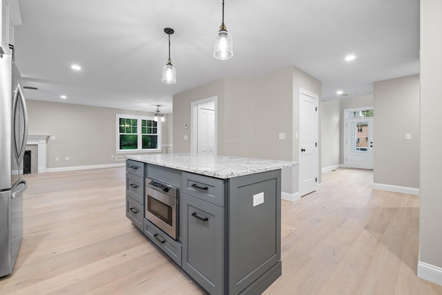 214 Pembroke St Unit A, Pembroke, NH 03275 - kitchen with gray cabinetry, appliances with stainless steel finishes, light wood finished floors, baseboards, and recessed lighting