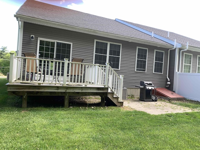 54 Cielo Dr, Dover, NH 03820 - rear view of property featuring a wooden deck, a lawn, a patio area, and a shingled roof