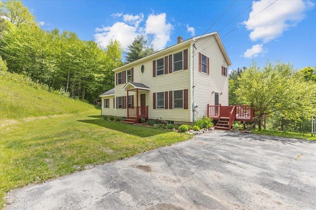 354 Falls Bridge Rd, Williamstown, VT 05679 - colonial house featuring a deck, a chimney, and a front lawn