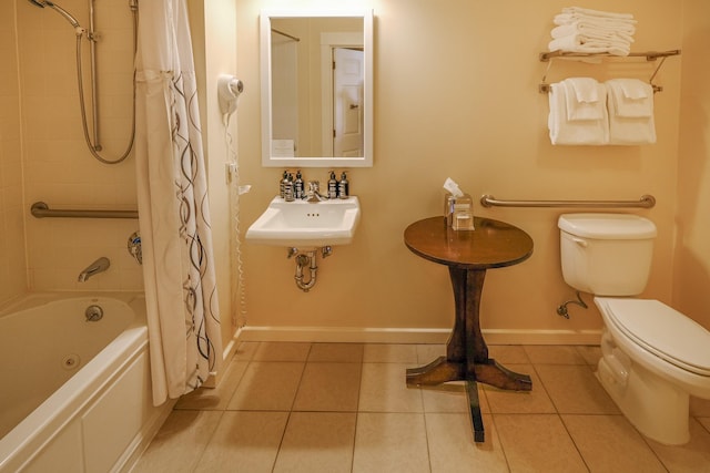 240QII Jackson Gore Inn Unit 240Qii, Ludlow, VT 05149 - full bath featuring toilet, a sink, tile patterned flooring, shower / bath combination with curtain, and baseboards