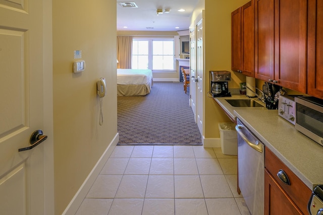 240QII Jackson Gore Inn Unit 240Qii, Ludlow, VT 05149 - kitchen featuring a sink, stainless steel appliances, baseboards, light countertops, and light colored carpet