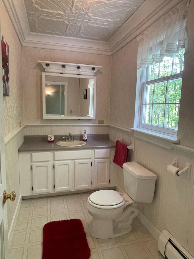 139 Rice Brook Dr, Stoddard, NH 03464 - bathroom with a baseboard radiator, toilet, vanity, an ornate ceiling, and crown molding