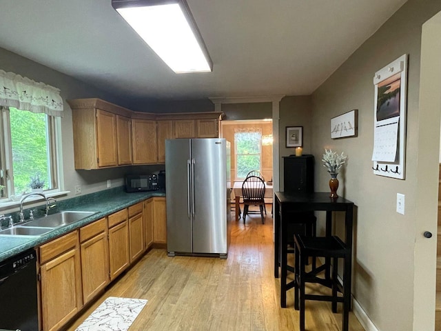 139 Rice Brook Dr, Stoddard, NH 03464 - kitchen with black appliances, a sink, light wood-style flooring, and dark countertops
