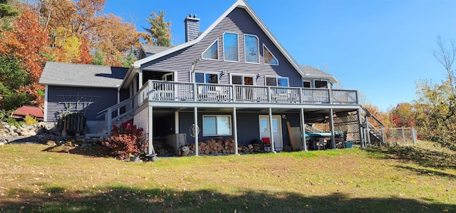86 Juniper Ln, Acton, ME 04001 - rear view of house featuring stairs, a wooden deck, a chimney, and a yard