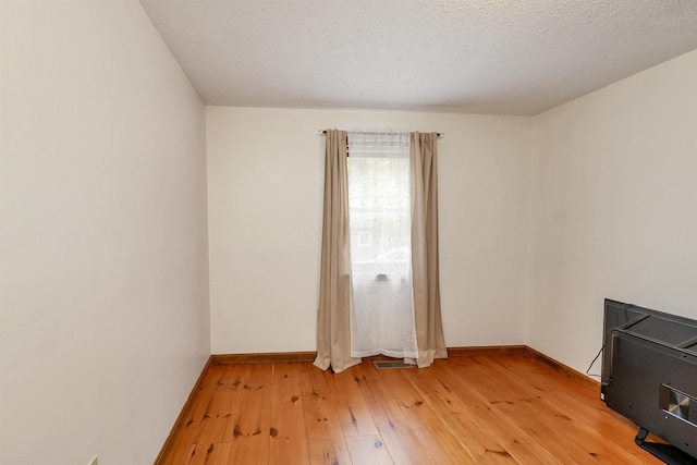 72 Mather Rd, Tamworth, NH 03886 - unfurnished room with light wood-style floors and baseboards