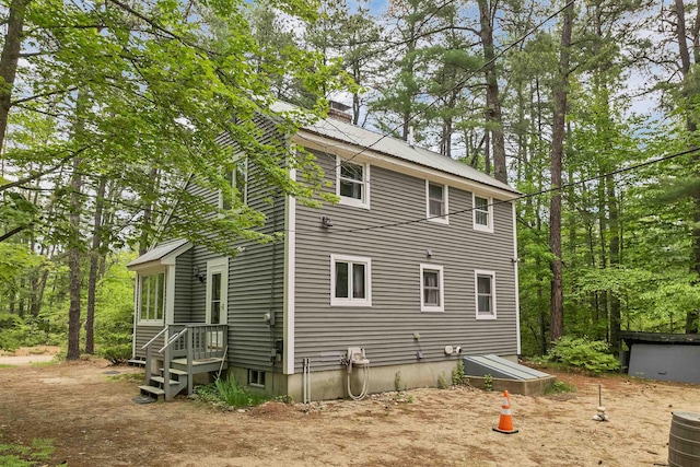 72 Mather Rd, Tamworth, NH 03886 - view of home's exterior with a chimney