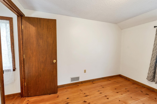 72 Mather Rd, Tamworth, NH 03886 - empty room featuring hardwood / wood-style floors, baseboards, and vaulted ceiling