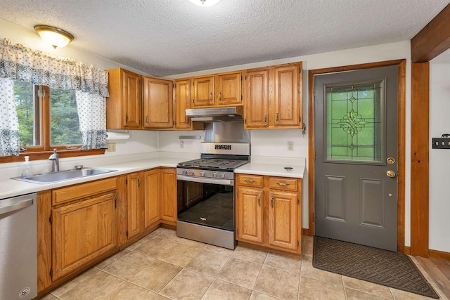 72 Mather Rd, Tamworth, NH 03886 - kitchen featuring stainless steel appliances, a sink, under cabinet range hood, light countertops, and a textured ceiling