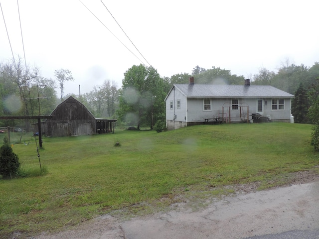126 Fisher Rd, Deering, NH 03244 - view of green lawn with a barn and an outdoor structure