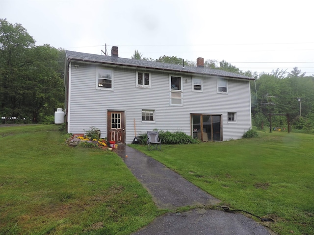 126 Fisher Rd, Deering, NH 03244 - back of property with a chimney and a lawn