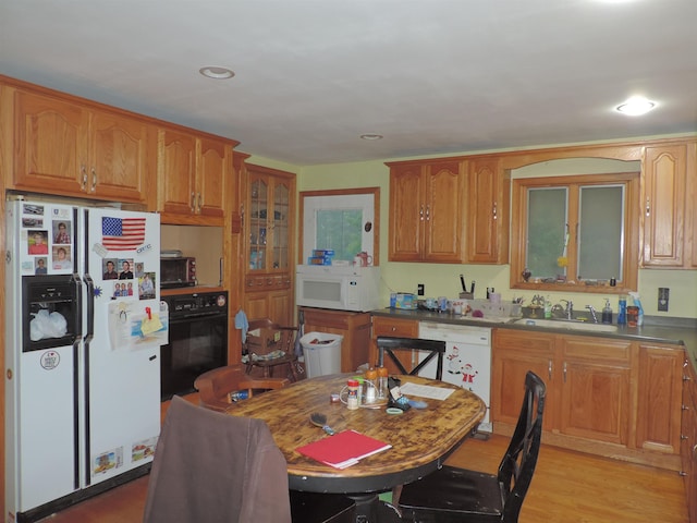 126 Fisher Rd, Deering, NH 03244 - kitchen with white appliances, a sink, brown cabinets, light wood-style flooring, and recessed lighting