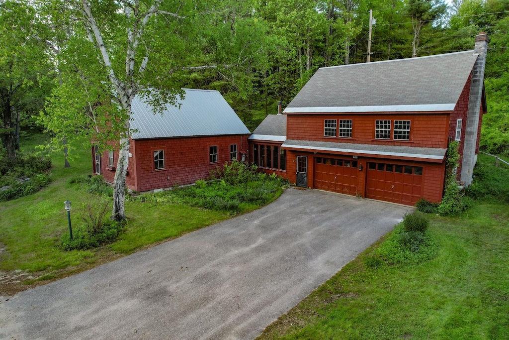 1678 Fowler River Rd, Alexandria, NH 03222 - view of front facade featuring driveway, a front lawn, and a chimney