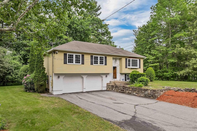 1 Pepperell Cir, Nashua, NH 03062 - split foyer home with a garage, driveway, and a front lawn
