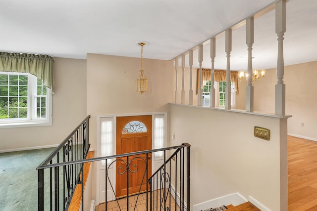1 Pepperell Cir, Nashua, NH 03062 - staircase with a chandelier and baseboards