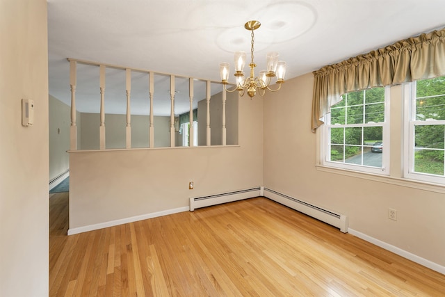 1 Pepperell Cir, Nashua, NH 03062 - unfurnished room featuring wood finished floors, a chandelier, a baseboard heating unit, and baseboards
