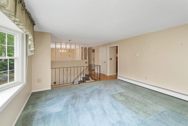 1 Pepperell Cir, Nashua, NH 03062 - carpeted empty room featuring baseboard heating, plenty of natural light, baseboards, and a chandelier