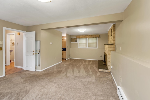 1 Pepperell Cir, Nashua, NH 03062 - carpeted empty room with an AC wall unit, baseboards, and baseboard heating