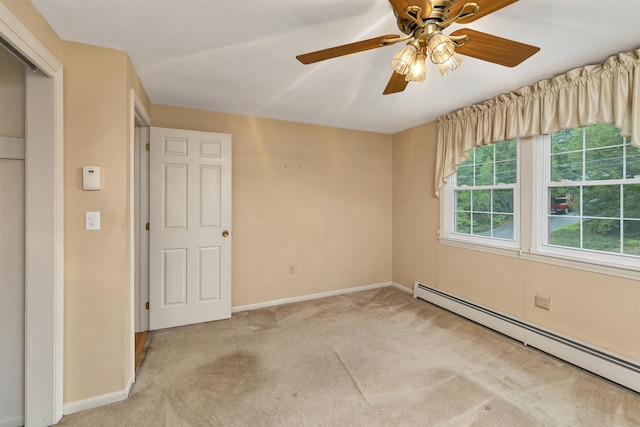 1 Pepperell Cir, Nashua, NH 03062 - carpeted empty room featuring a baseboard radiator, baseboards, and ceiling fan