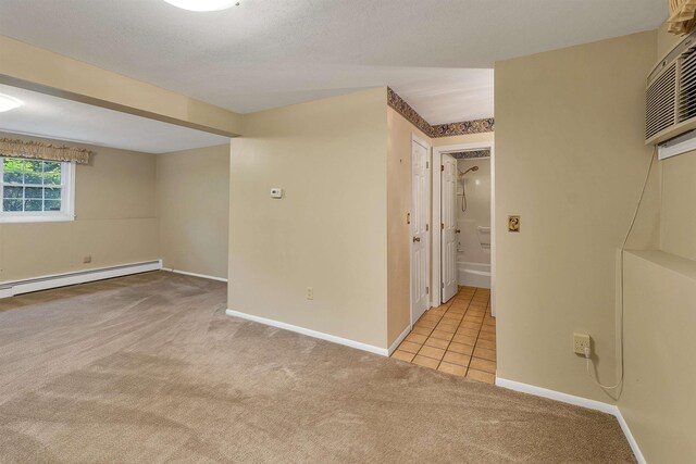 1 Pepperell Cir, Nashua, NH 03062 - carpeted spare room with a baseboard heating unit, baseboards, and tile patterned flooring