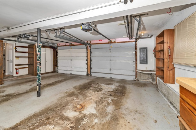 1 Pepperell Cir, Nashua, NH 03062 - garage featuring a garage door opener