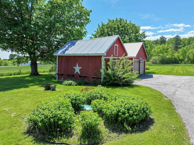 358 S Main St, Whiting, VT 05778 - view of outdoor structure with a garage and asphalt driveway