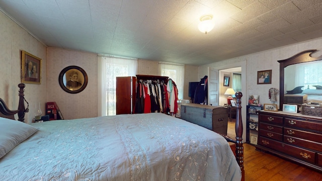 358 S Main St, Whiting, VT 05778 - bedroom featuring wood finished floors and wallpapered walls