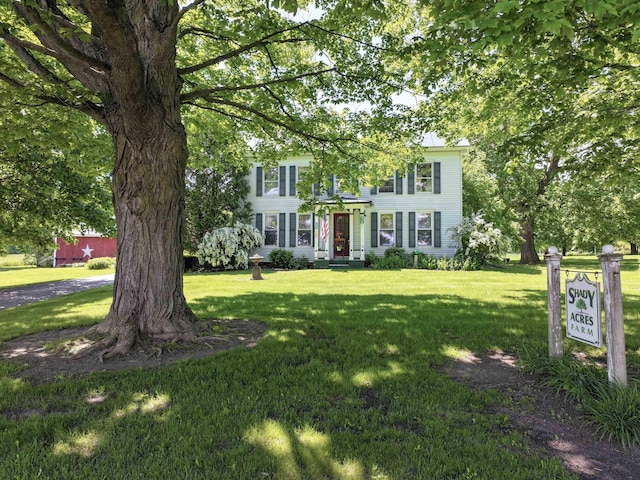 358 S Main St, Whiting, VT 05778 - colonial house featuring a front yard