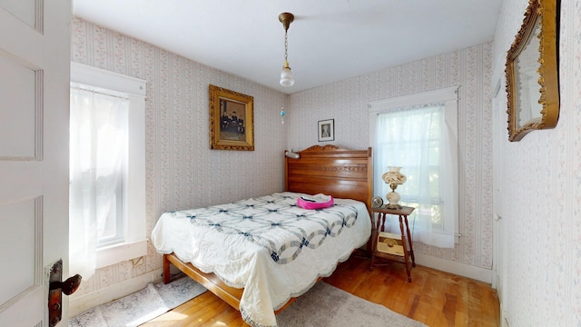 358 S Main St, Whiting, VT 05778 - bedroom with wood finished floors and wallpapered walls