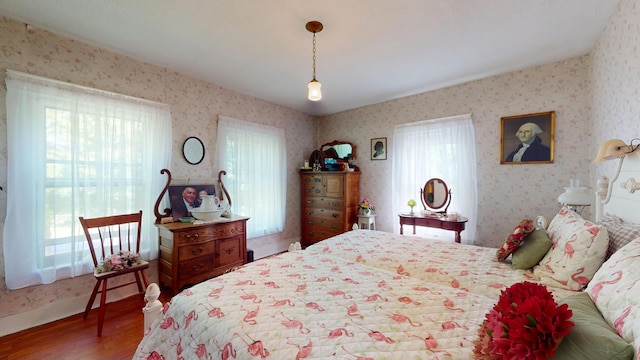 358 S Main St, Whiting, VT 05778 - bedroom with wood finished floors and wallpapered walls