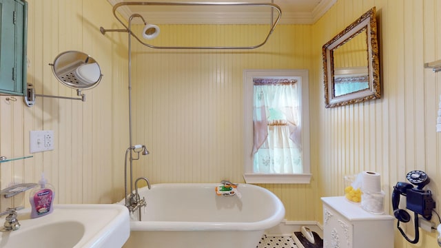 358 S Main St, Whiting, VT 05778 - bathroom with a freestanding bath, wooden walls, and crown molding