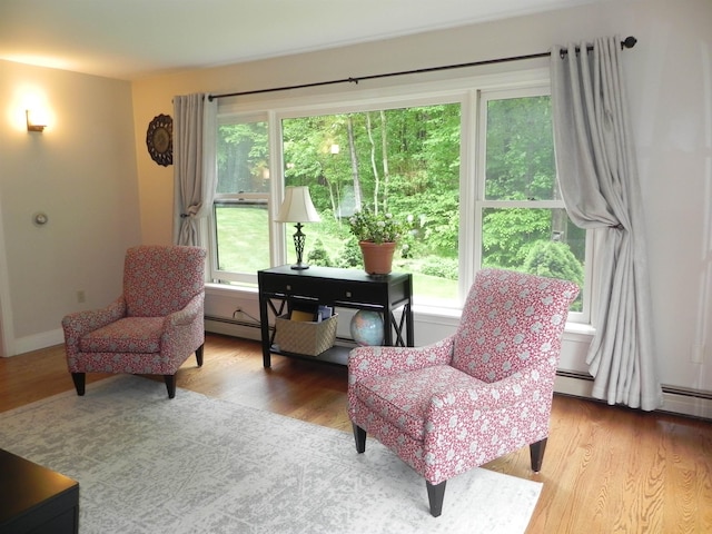 1782 Old Creamery Rd, Williston, VT 05495 - sitting room featuring wood finished floors, baseboards, and a baseboard heating unit