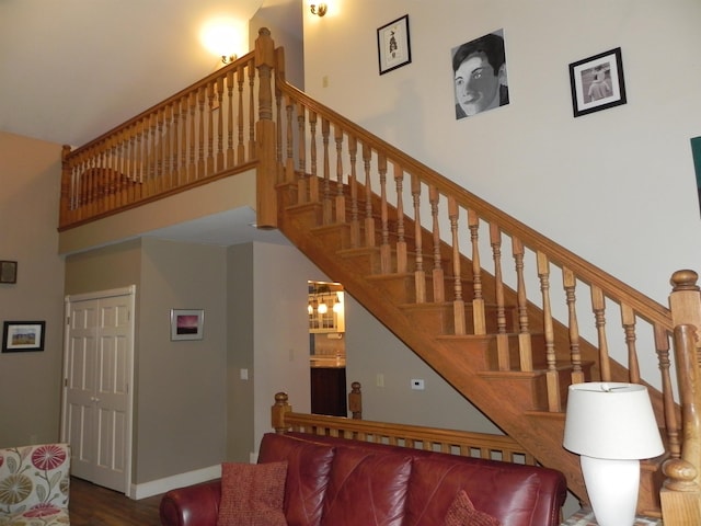 1782 Old Creamery Rd, Williston, VT 05495 - stairway featuring a high ceiling, wood finished floors, and baseboards