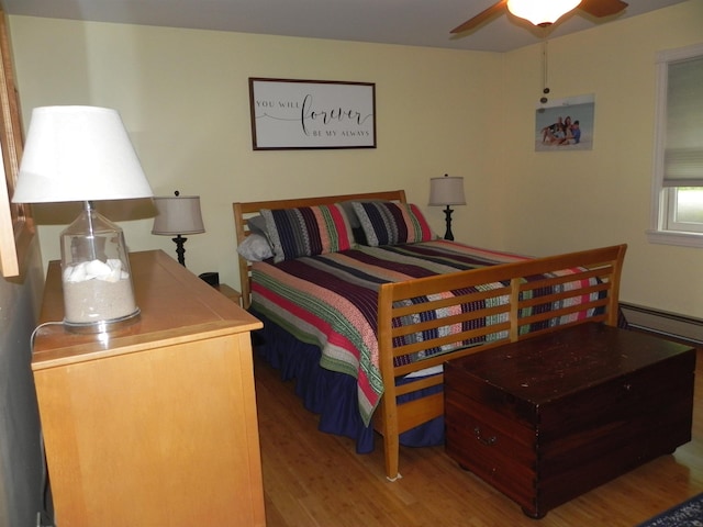 1782 Old Creamery Rd, Williston, VT 05495 - bedroom with light wood-type flooring and a baseboard radiator
