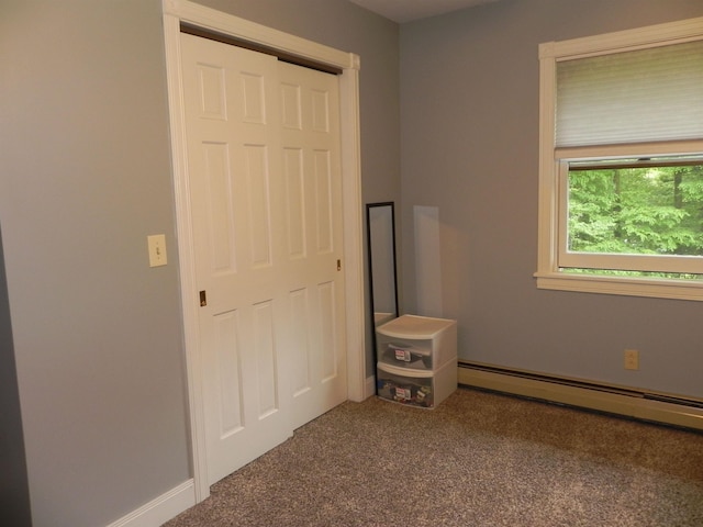 1782 Old Creamery Rd, Williston, VT 05495 - unfurnished bedroom with carpet floors, a baseboard heating unit, and baseboards