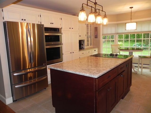 1782 Old Creamery Rd, Williston, VT 05495 - kitchen featuring appliances with stainless steel finishes, white cabinetry, light stone counters, glass insert cabinets, and pendant lighting