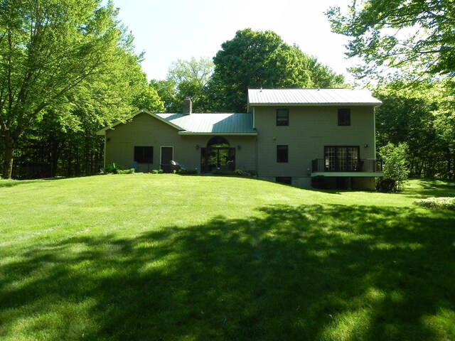 1782 Old Creamery Rd, Williston, VT 05495 - back of house featuring a yard, metal roof, and a chimney