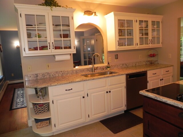 1782 Old Creamery Rd, Williston, VT 05495 - kitchen featuring dishwasher, a sink, arched walkways, white cabinetry, and open shelves