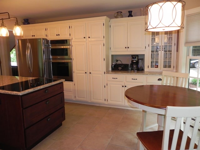 1782 Old Creamery Rd, Williston, VT 05495 - kitchen featuring appliances with stainless steel finishes, white cabinetry, and light stone countertops