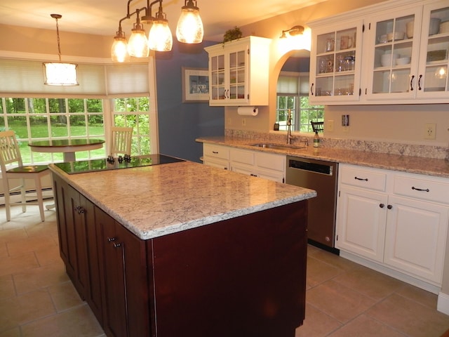 1782 Old Creamery Rd, Williston, VT 05495 - kitchen featuring stainless steel dishwasher, a sink, a center island, black electric stovetop, and white cabinets
