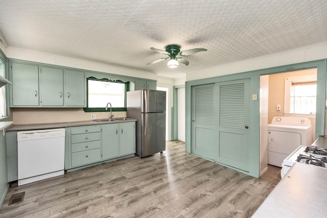 247 Prospect St, Manchester, NH 03104 - kitchen featuring white appliances, washer / clothes dryer, a sink, green cabinets, and a ceiling fan