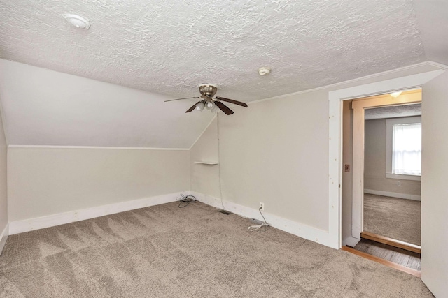 247 Prospect St, Manchester, NH 03104 - bonus room featuring a ceiling fan, carpet, a textured ceiling, baseboards, and lofted ceiling