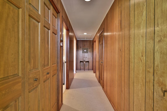 775 E Lake Rd, Ludlow, VT 05149 - hall with attic access, wooden walls, and light colored carpet