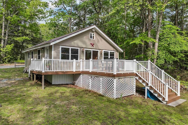 22 Shore Dr, Middleton, NH 03887 - rear view of house with a lawn, a deck, stairs, and view of scattered trees