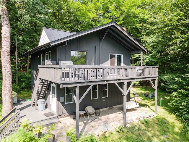 25 Hilltop Dr, Newbury, NH 03255 - rear view of house with a deck, stairway, and a patio area