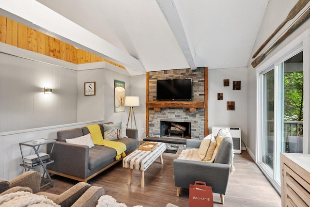 25 Hilltop Dr, Newbury, NH 03255 - living room featuring lofted ceiling, wood finished floors, and a stone fireplace