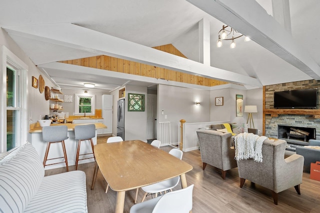 25 Hilltop Dr, Newbury, NH 03255 - dining area with a stone fireplace and light wood-style floors