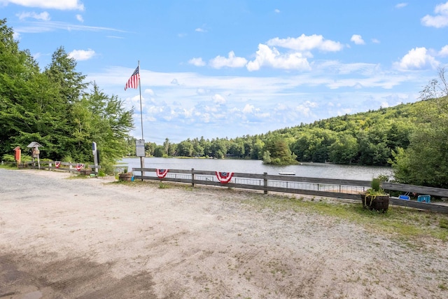 25 Hilltop Dr, Newbury, NH 03255 - view of parking / parking lot with a view of trees and a water view
