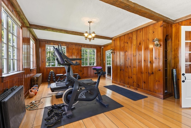 79 Silver St, Dover, NH 03820 - exercise area with wooden walls, hardwood / wood-style flooring, and a chandelier