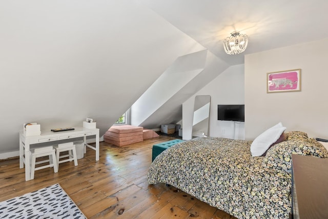 79 Silver St, Dover, NH 03820 - bedroom with wood-type flooring, lofted ceiling, and a chandelier