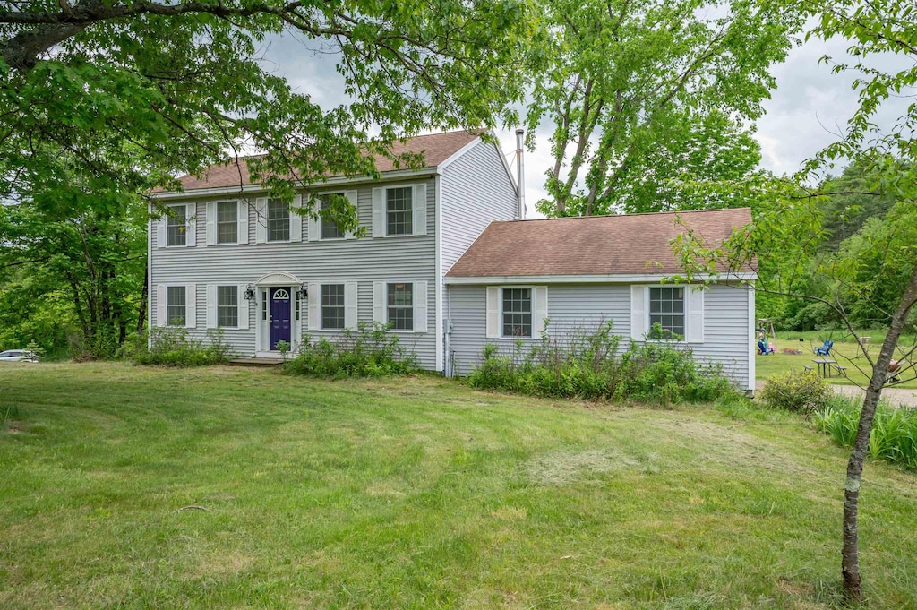 401 River Rd, Weare, NH 03281 - colonial inspired home with a front yard, a chimney, and roof with shingles